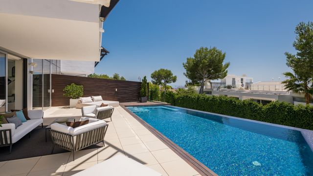 Offbeat semi-detached modern luxury house with panoramic sea views in Sierra Blanca Marbella 